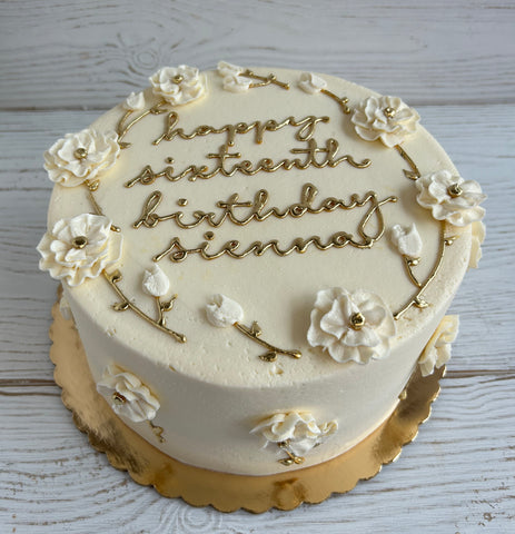 Elegant White Flowers Cake with Gold Writing